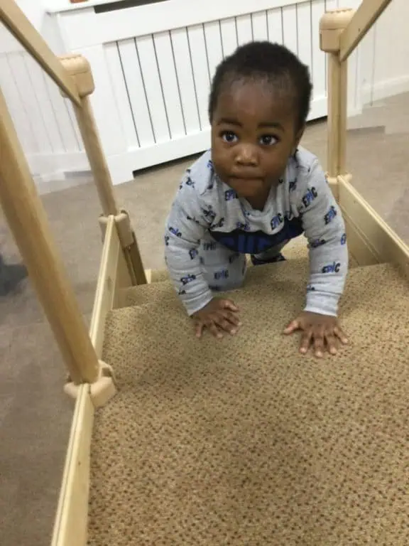 nursery child exploring climbing equipment nursery child exploring climbing equipment